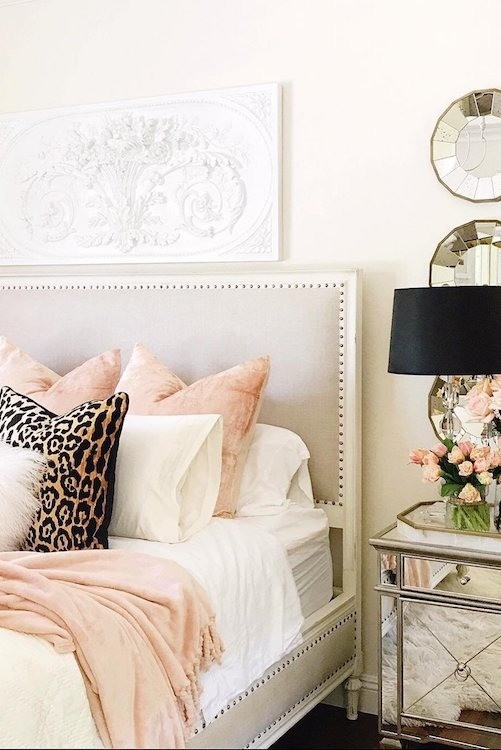 Hamptons bedroom decor with feminine styling including leopard print pillow 